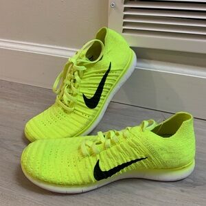 Like new! Nike Bright Lime Green with black Nike logo Flyknit Sneakers